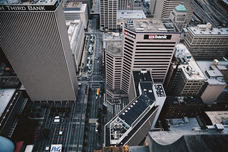An arial shot of two big bank buildings in a city