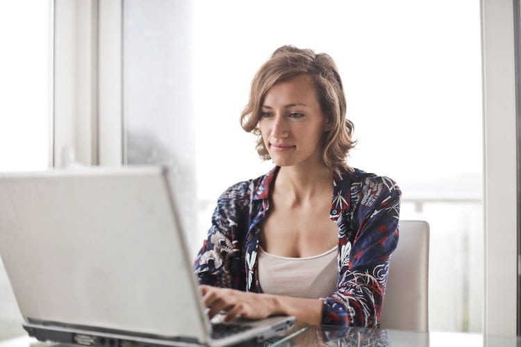 A woman using a laptop 