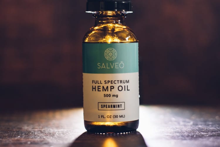A bottle of spearmint hemp oil