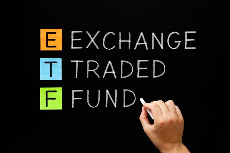 The words "exchange traded fund" written on a chalkboard