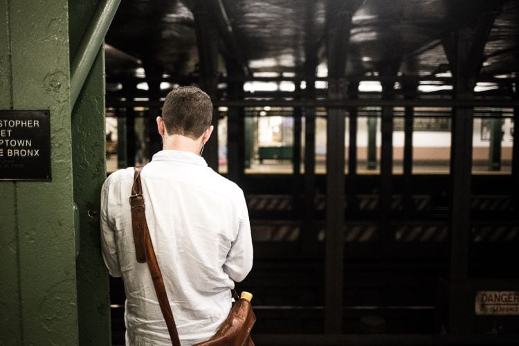 A man waiting for a subway in New York City
