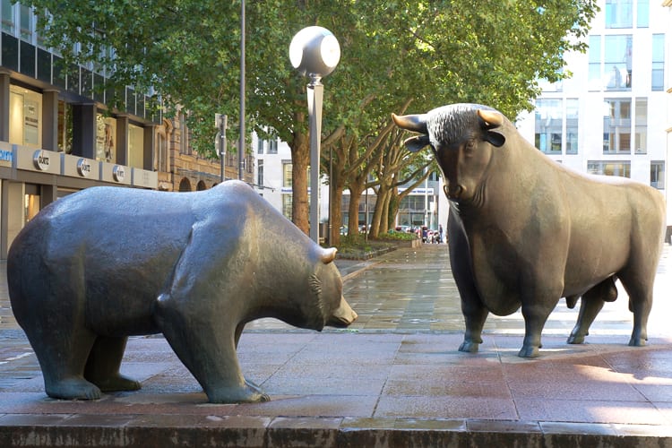 A statue of a bull and a statue of a bear