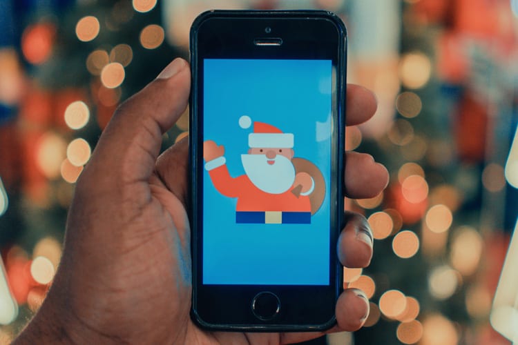 An iPhone displaying an illustration of Santa Claus