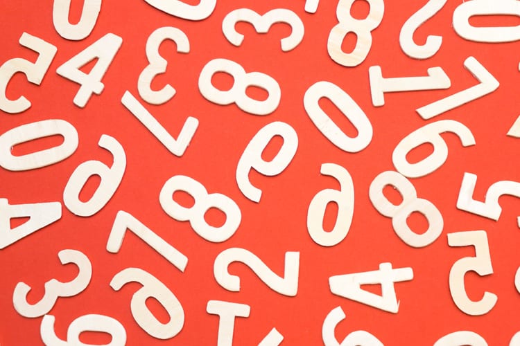 Various numbers scattered across an orange background