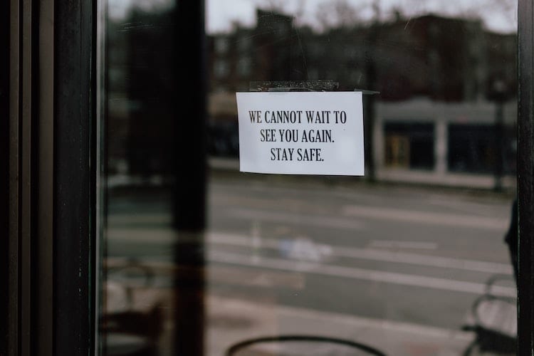 A sign posted on a storefront temporarily closed during the pandemic