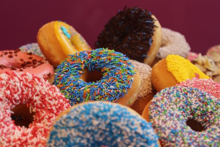 An assortment of colorful, sprinkled donuts 