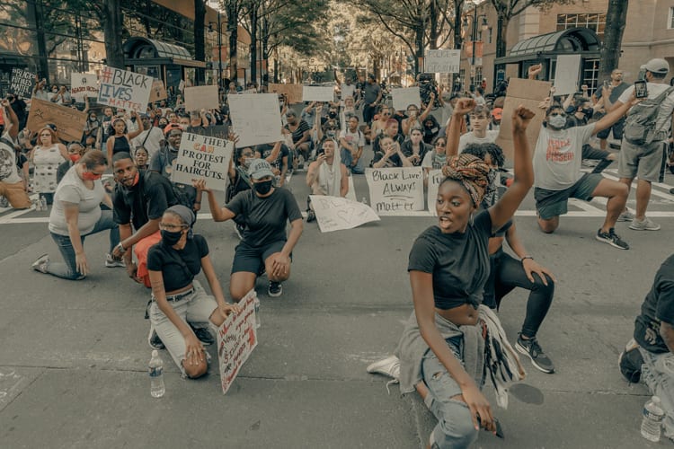 A group of Black Lives Matter protestors in Charlotte, North Carolina taking a knee