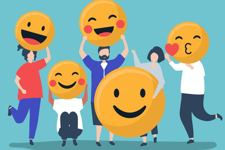 An illustration of people holding different smiley-face emojis