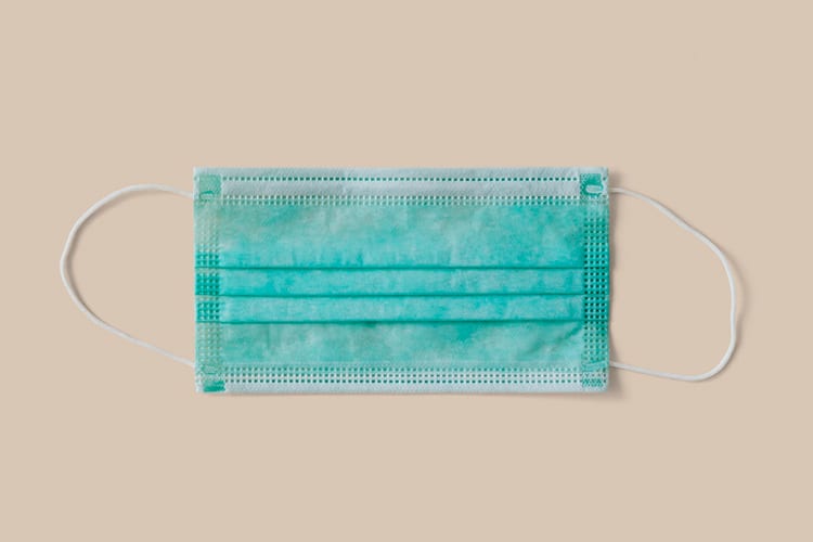 A protective, blue surgical mask