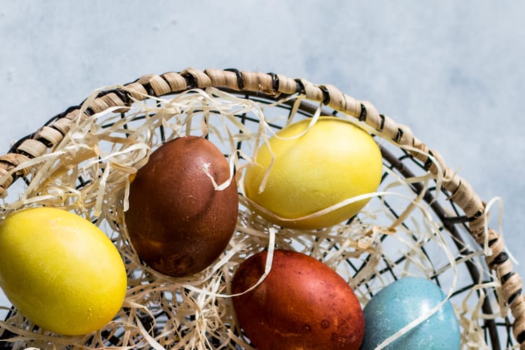 Colored eggs in a basket to symbolize nest egg for retirement