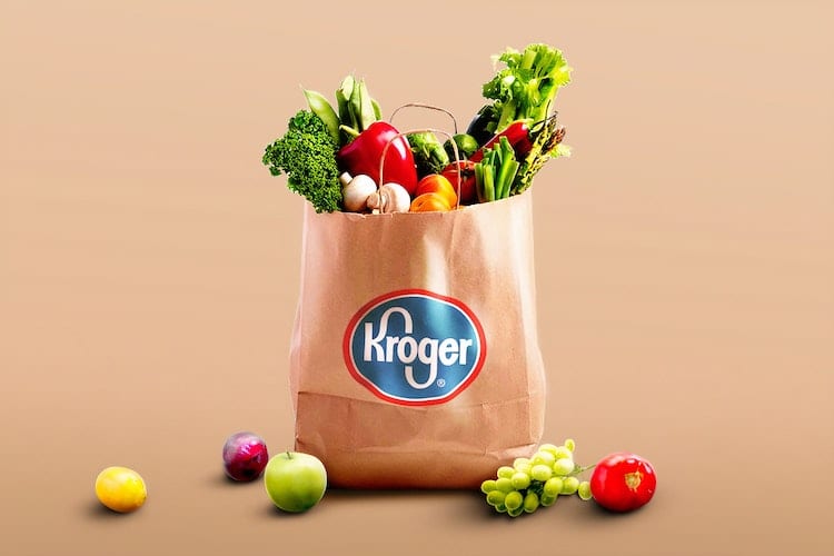A grocery bag from Kroger filled with fruit and vegetables