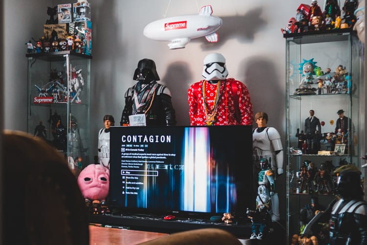 TV room with Star Wars, Gundam, and pop culture figurines
