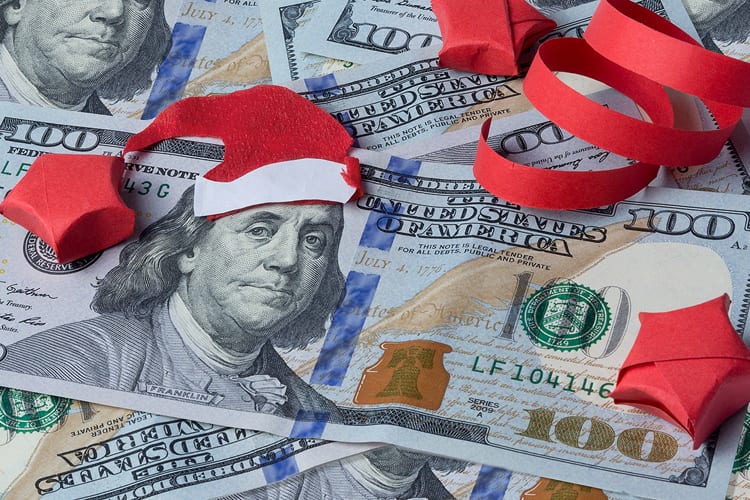 100 dollar bills with santa hat on Benjamin Franklin