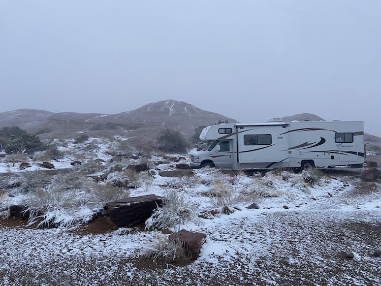 The Burch's RV weathering a storm in Moab, Utah