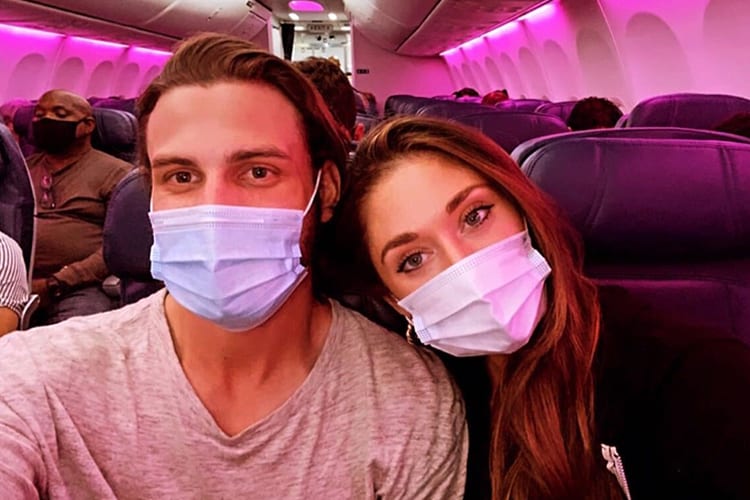 Masked couple on plane
